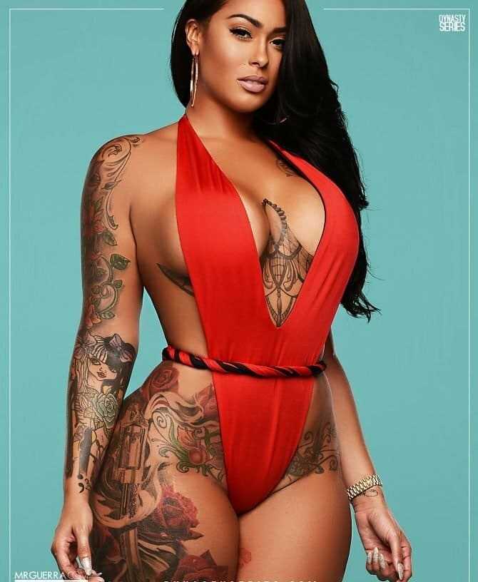 Hot black beauty girl in bikini with big tits ass tattooed.