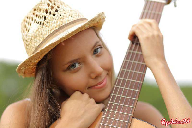 Naked girl with a guitar
