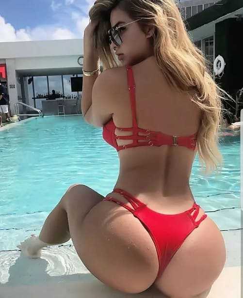 Beautiful girl blonde with a big sexy ass in a bikini photo